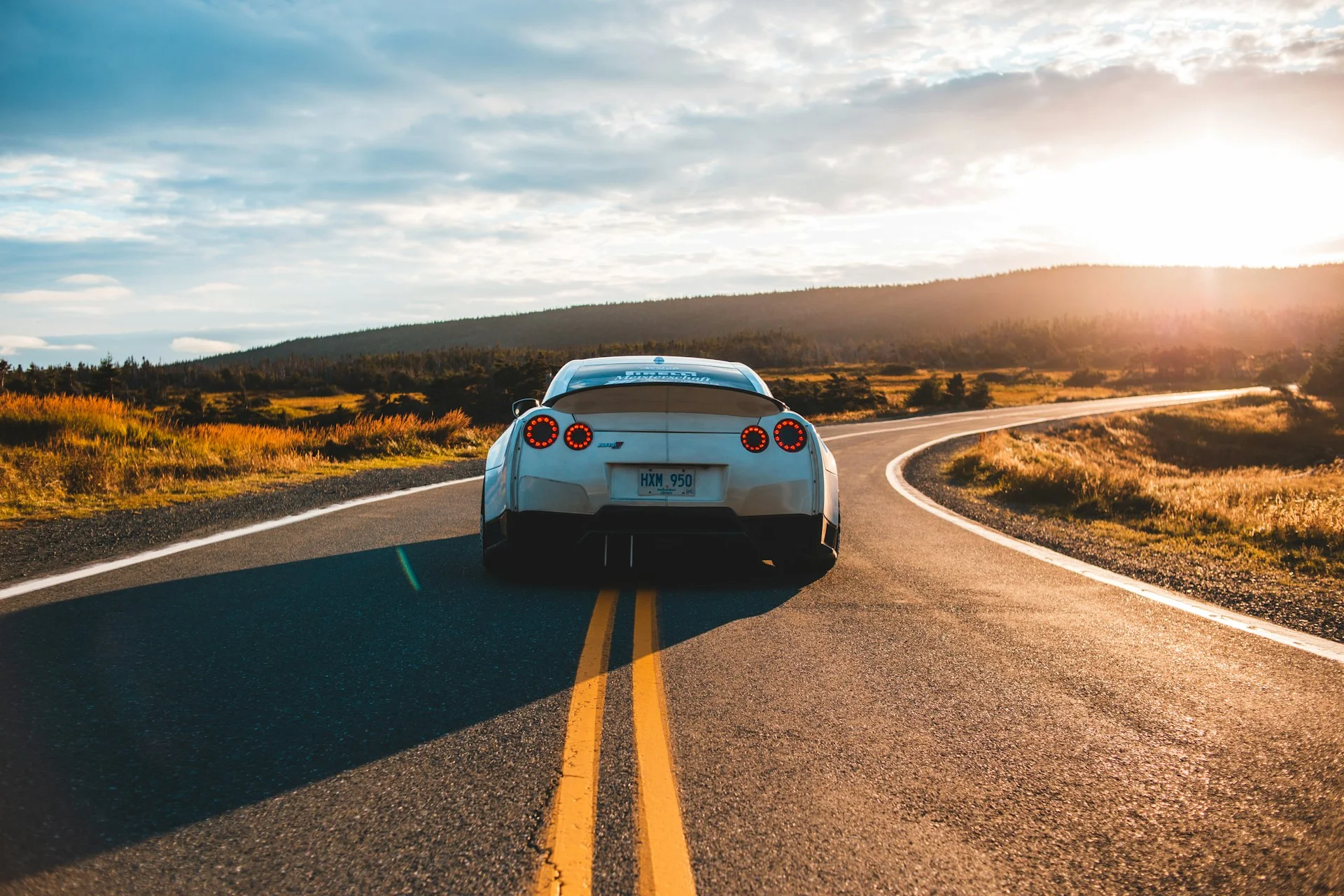 First-time car buyer reviewing auto loan paperwork at a dealership